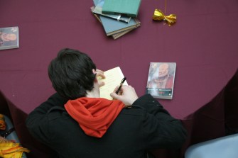 student taking notes