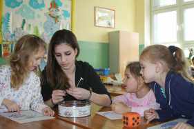 teacher and students with orange dice